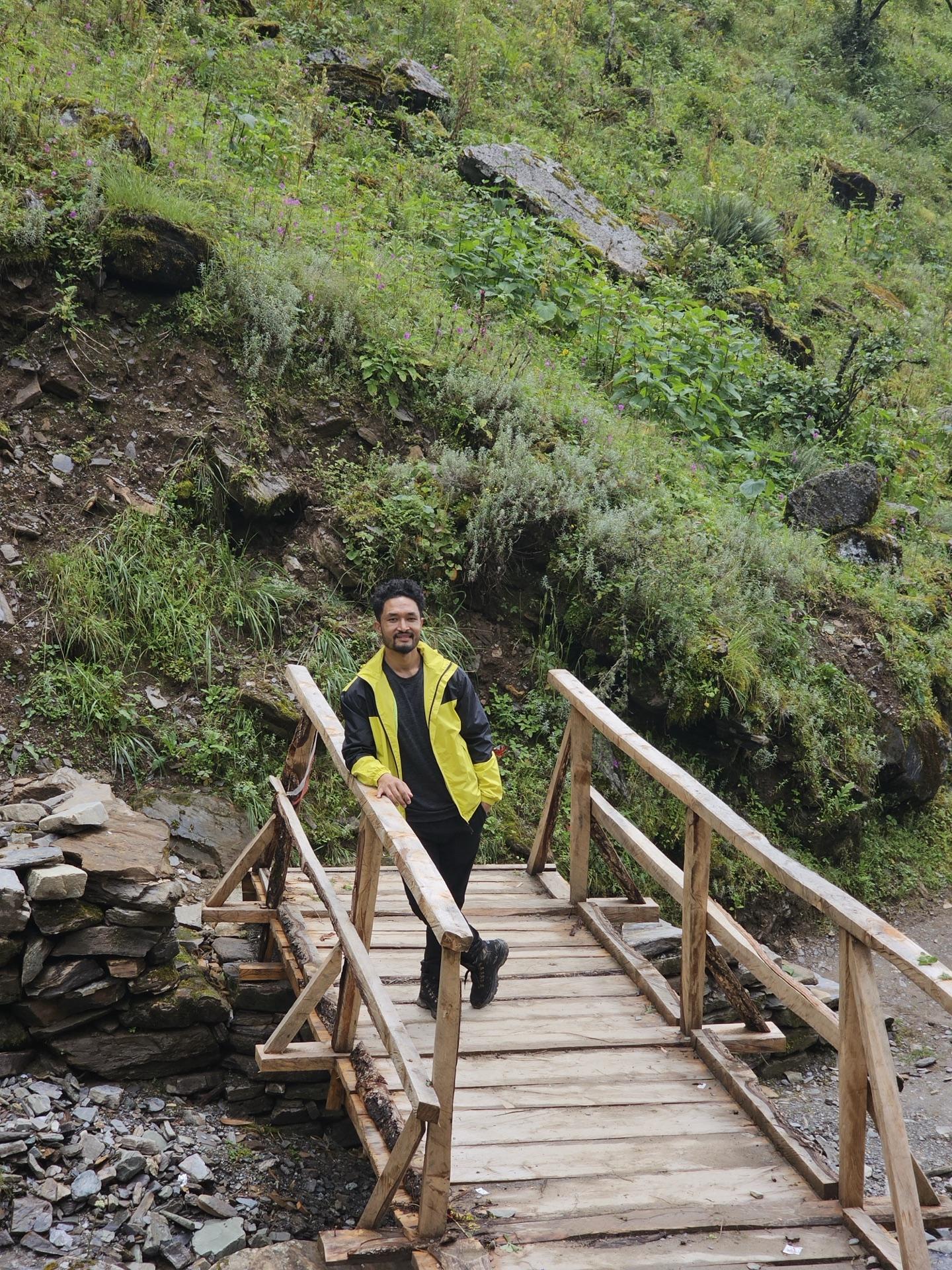 A friend crossing one of the trail's small wooden bridges