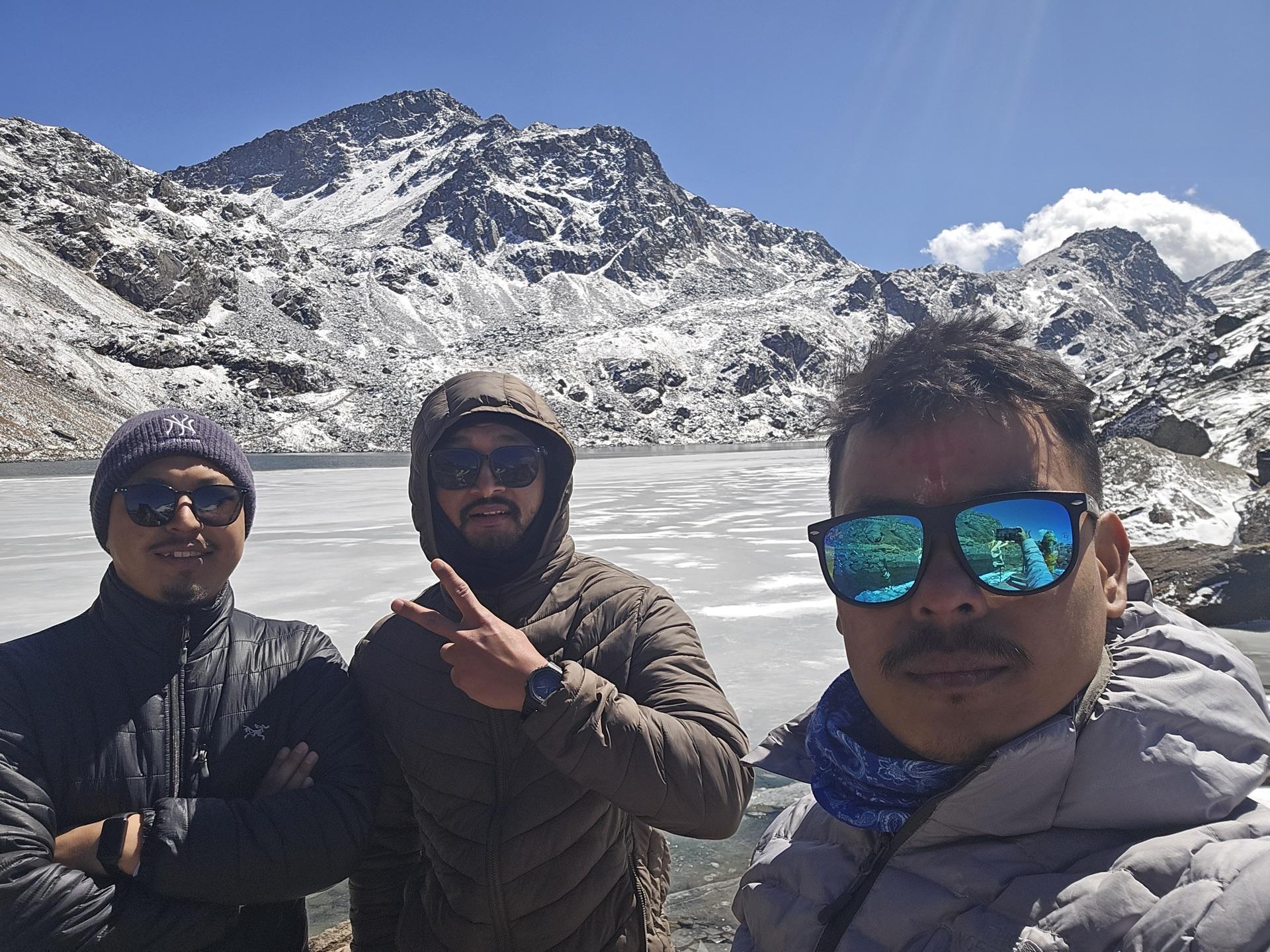 The three friends in a selfie at the half-frozen lake