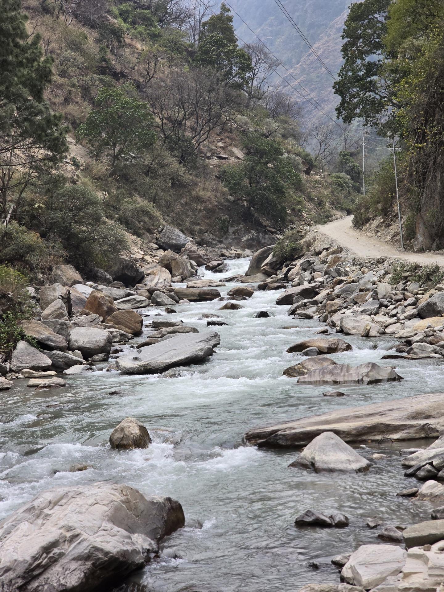 The Langtang Khola rushing between boulders beside the gorge road